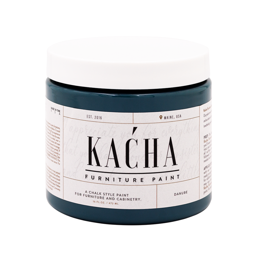 Jar of K£ňha furniture paint on a white background