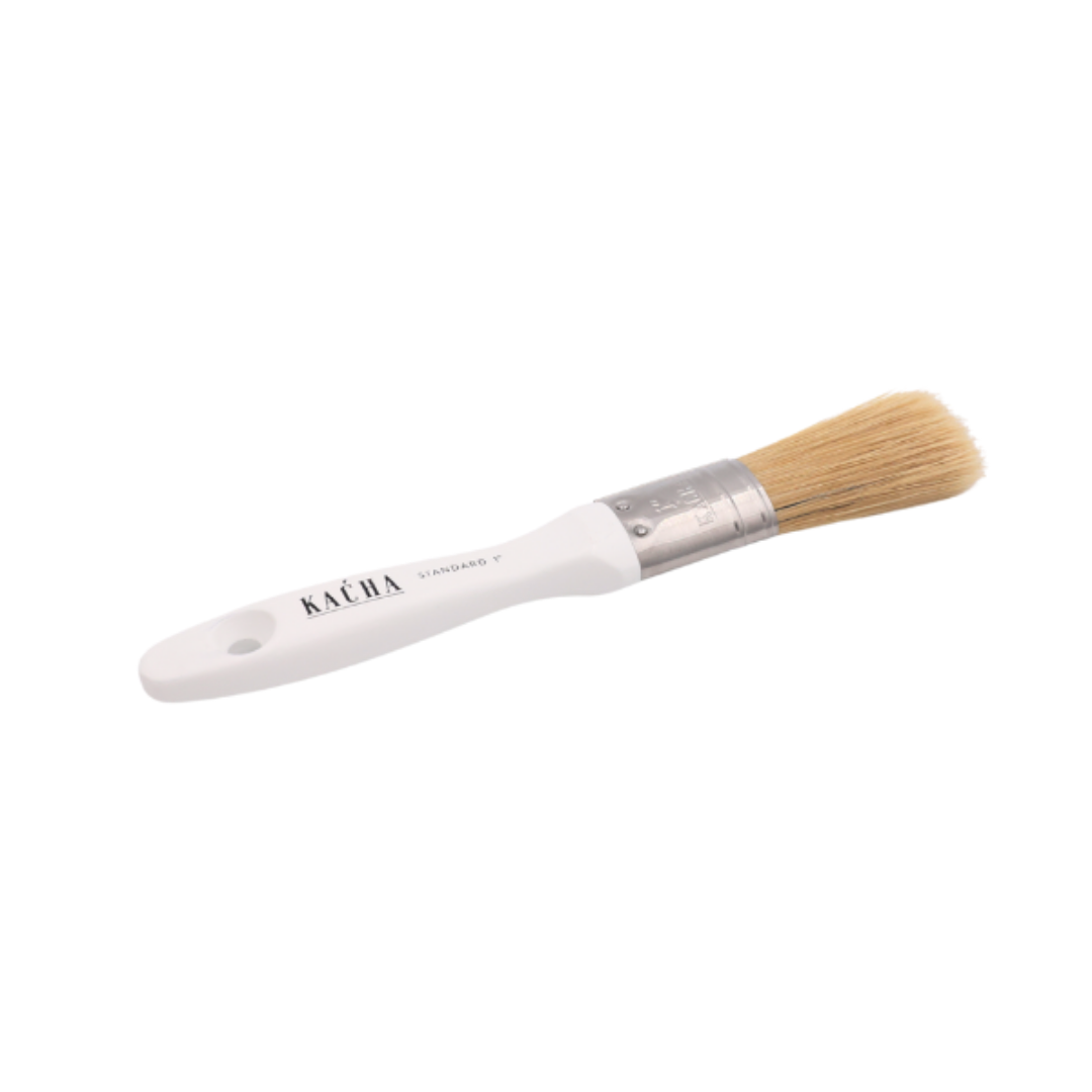 White brush with a wooden handle on a white background